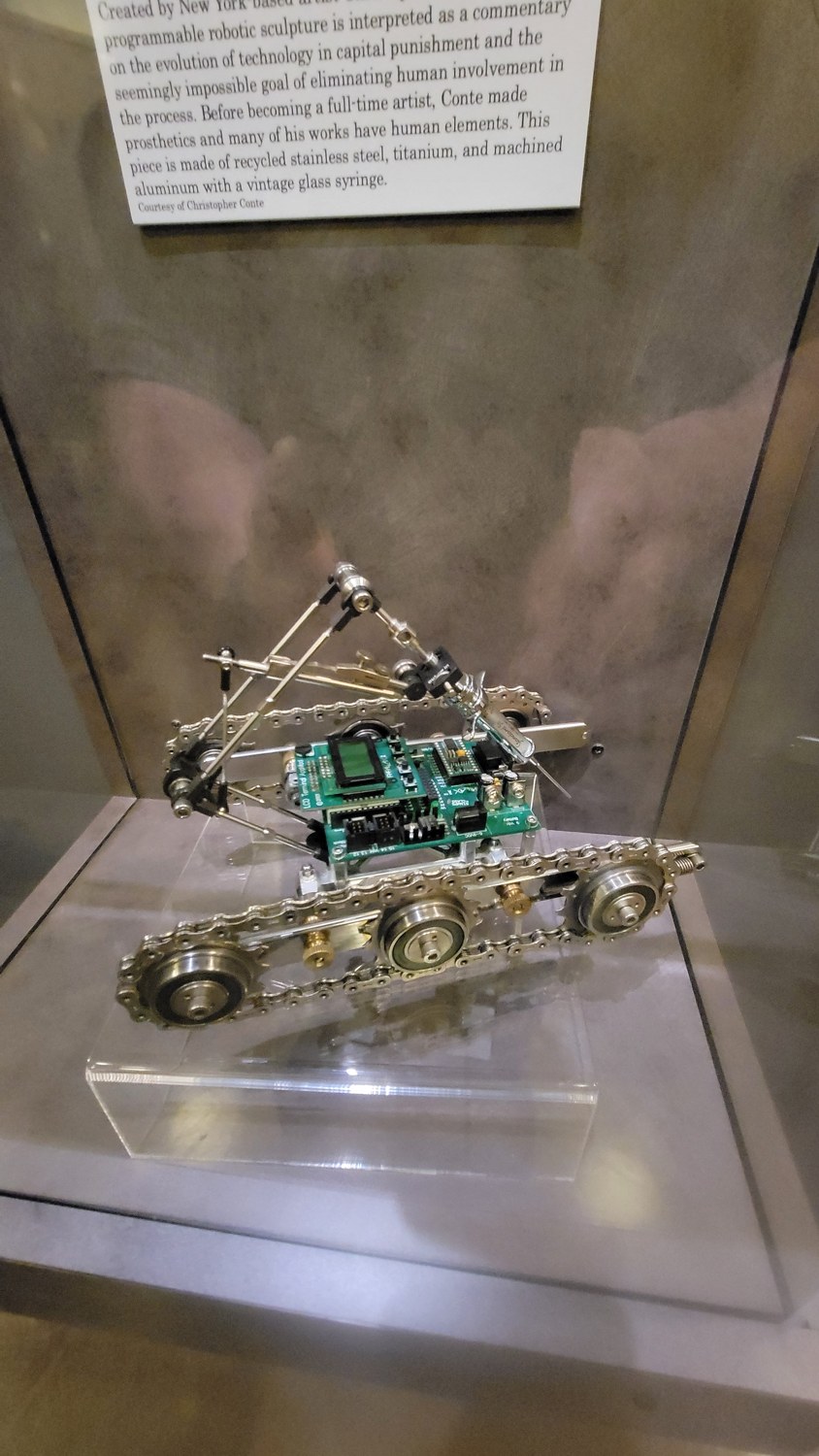 Figure 4 — The board in situ on the deck, between the tracks and beneath the
manipulator. The controller is mounted exposed, as a visible component of the
sculpture rather than hidden in a housing.…
