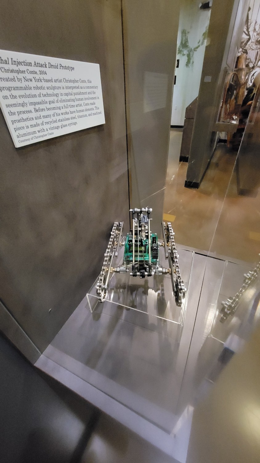Figure 3 — Near-frontal view. The splayed twin tracks and the central deck give
a broad, stable, machine-like stance; the manipulator reaches toward the viewer.
Sculpture courtesy of Christopher Co…