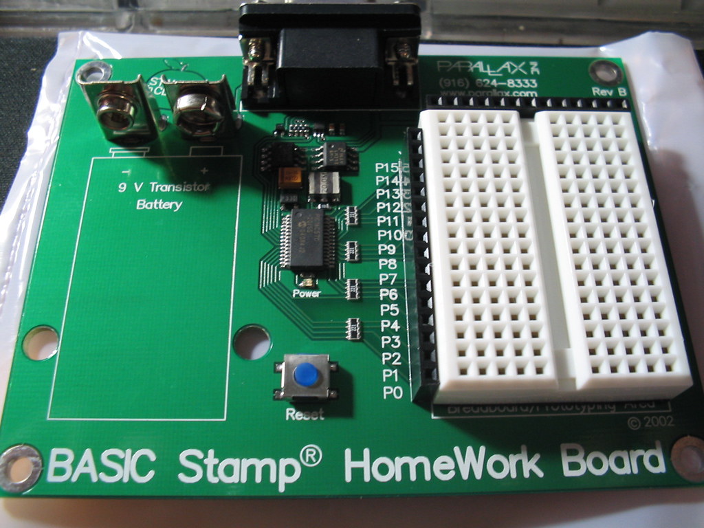 Figure 3 — A Parallax BASIC Stamp HomeWork Board — the component class of the
sculpture's genuine Parallax board. "basicstamp HomeWork Board" by mrbill is
licensed under CC BY 2.0. To view a copy o…